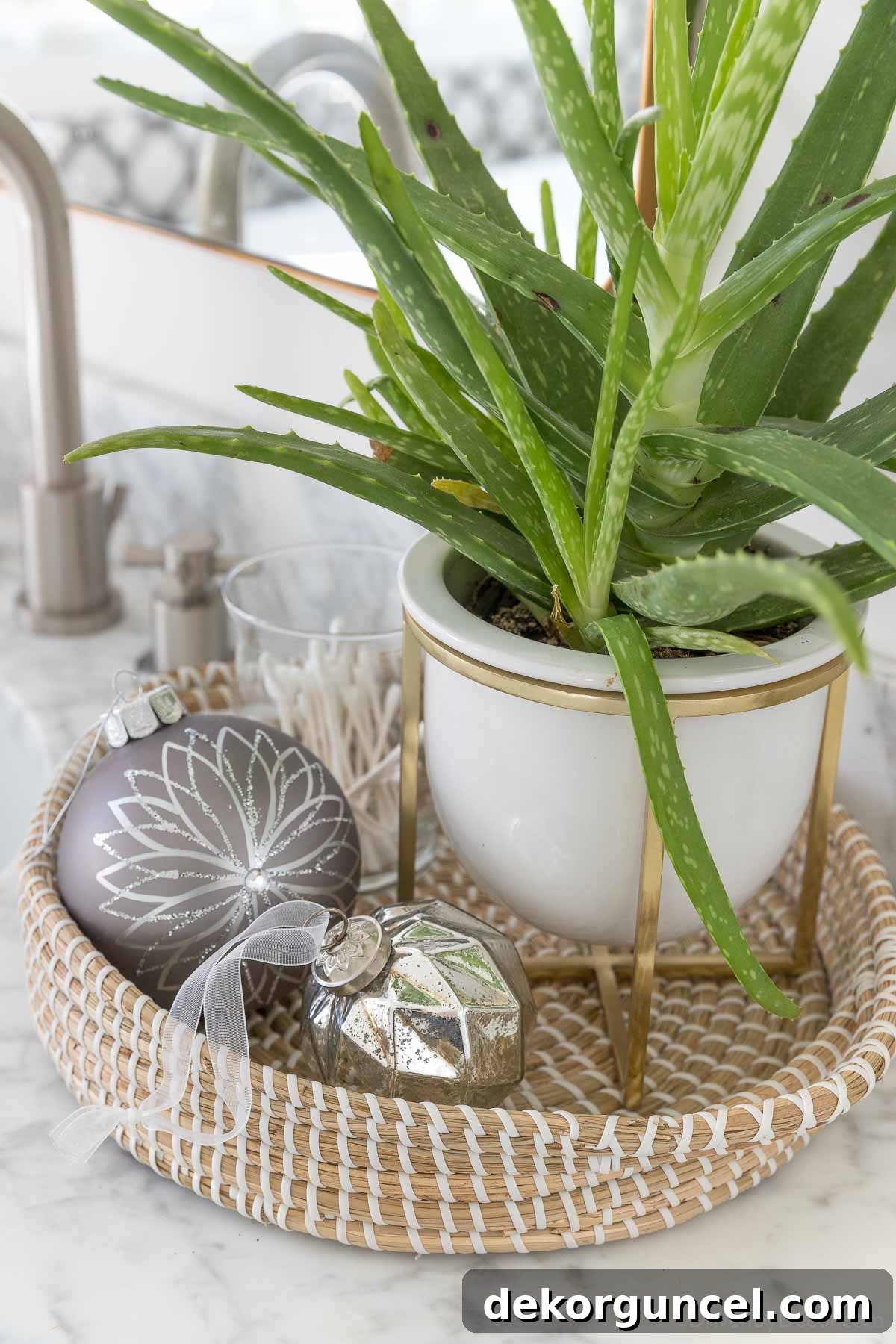 Small groupings of Christmas ornaments used as simple decorative accents on a shelf