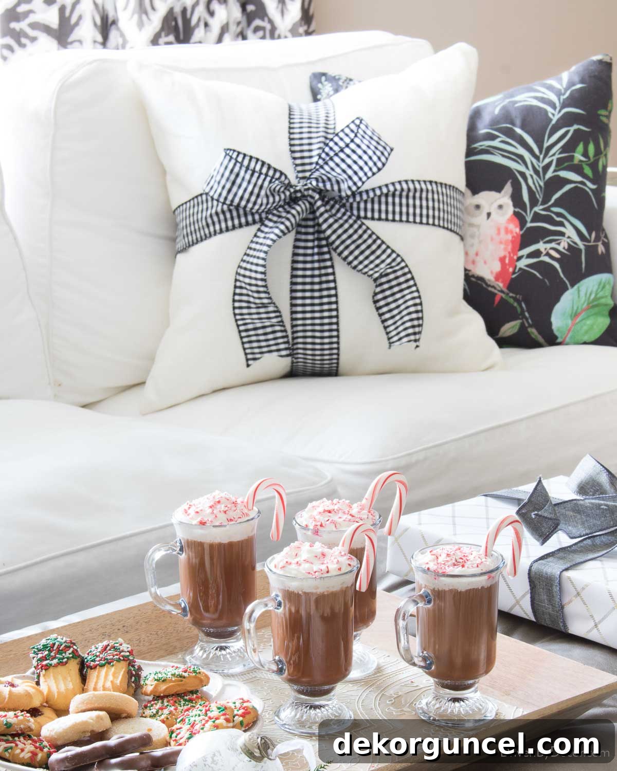 Pillow adorned with ribbon and a bow as simple Christmas decorations