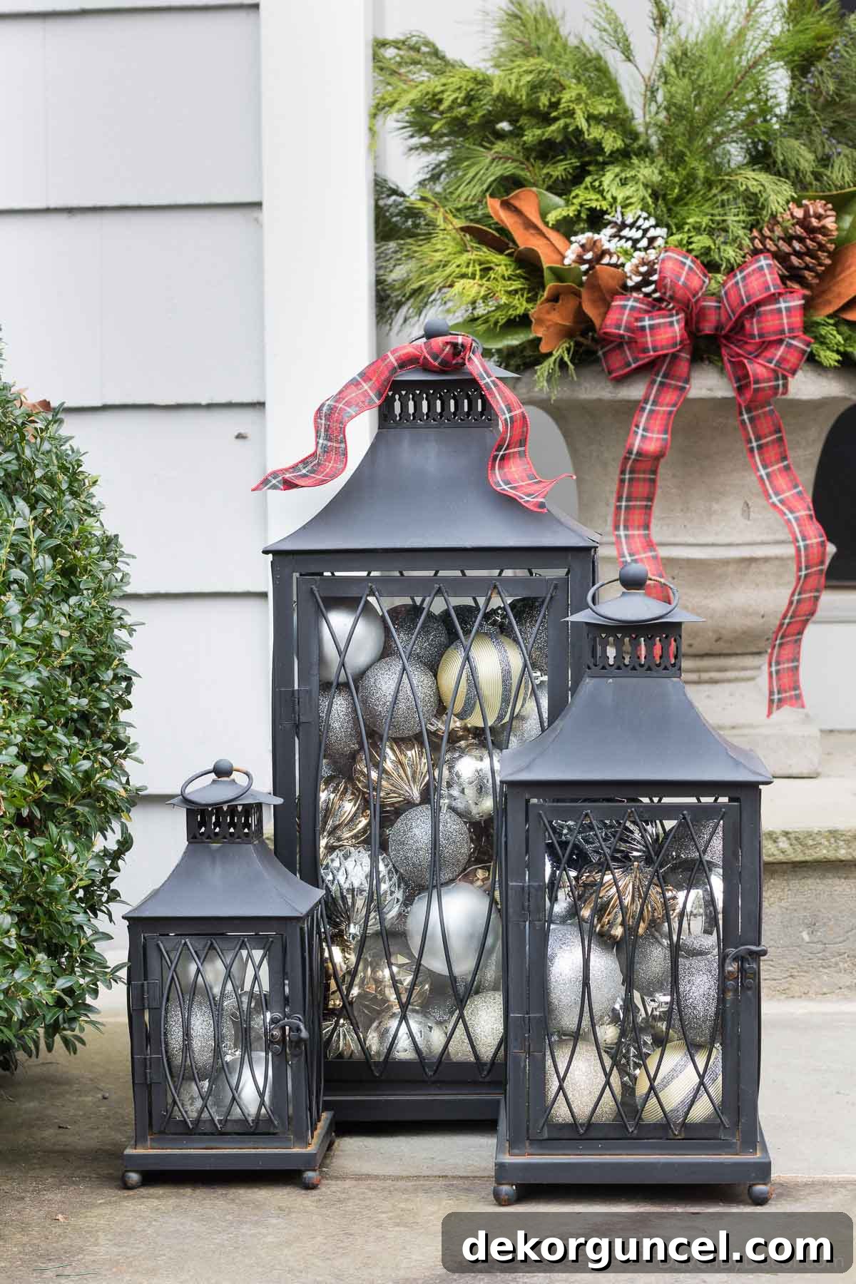 Outdoor lanterns filled with sparkly ball ornaments as a simple and dazzling Christmas decoration