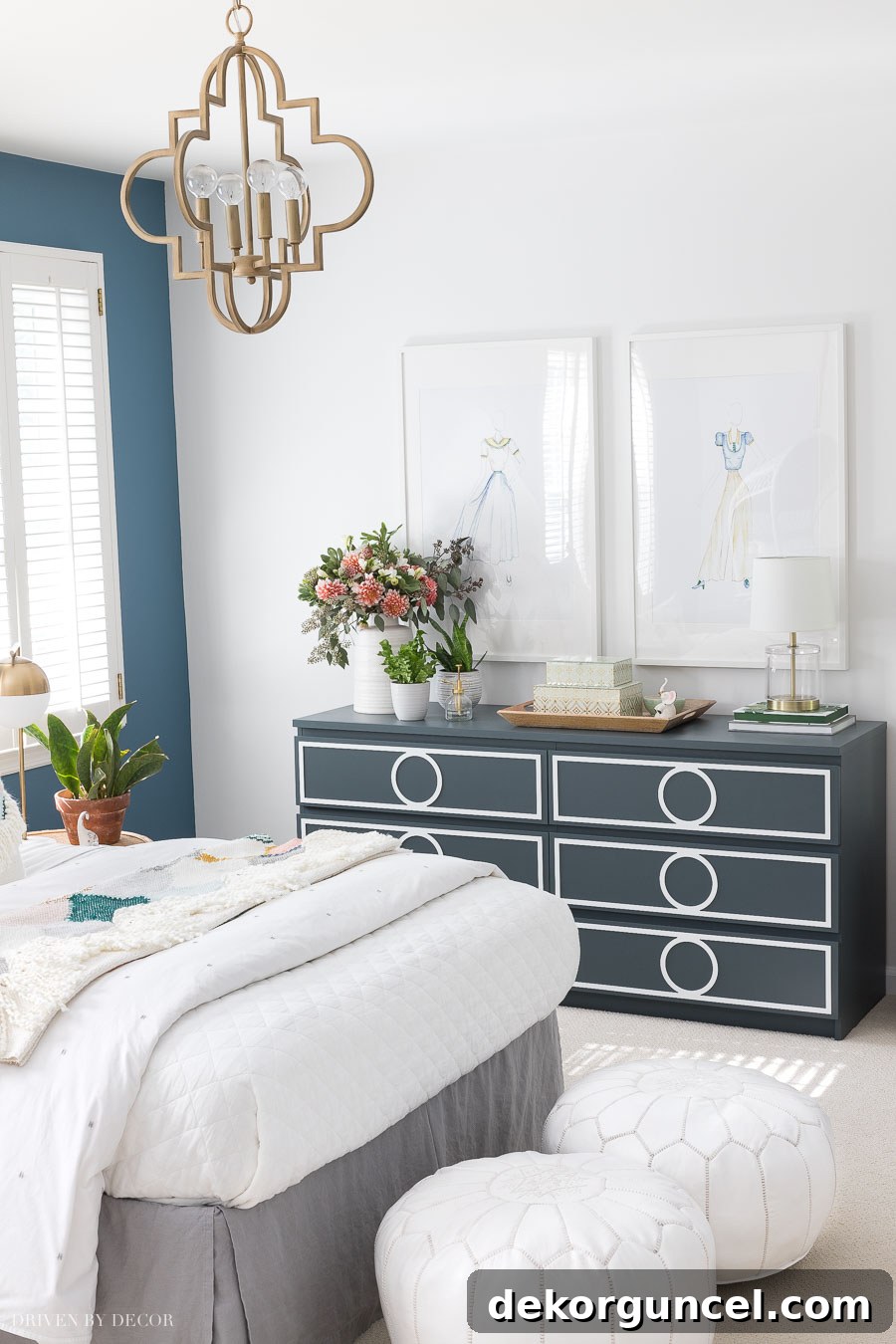 We painted three walls with Behr's White 52 - a great white paint color! This soft, cool-toned off-white pairs beautifully with blues, creating a serene and sophisticated bedroom atmosphere.