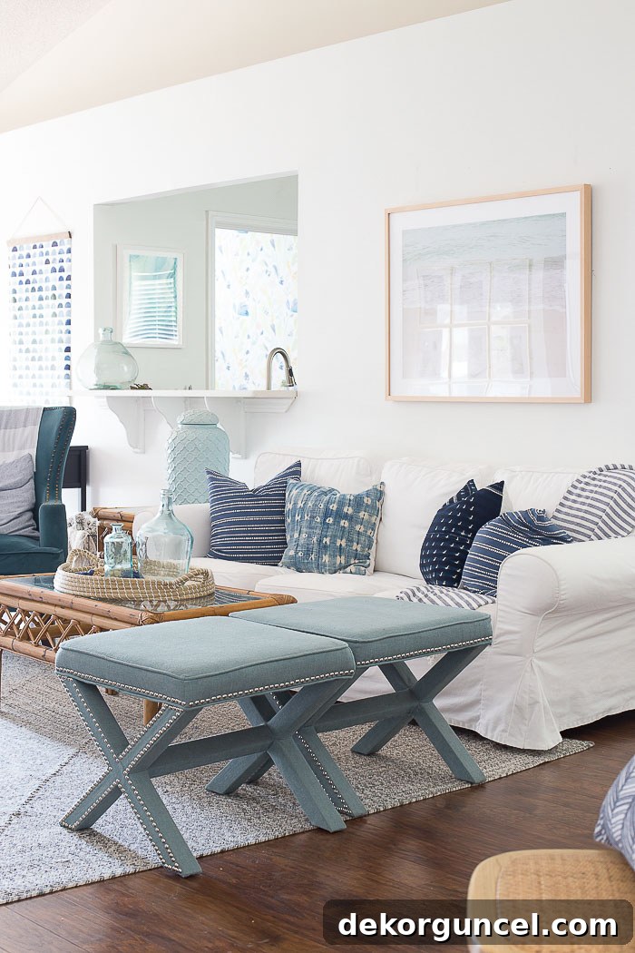 Benjamin Moore's Chantilly Lace is a beautiful crisp, clean white paint color - design from Making Home Base. This pure white brightens the living room, offering a fresh and sophisticated backdrop for modern decor.