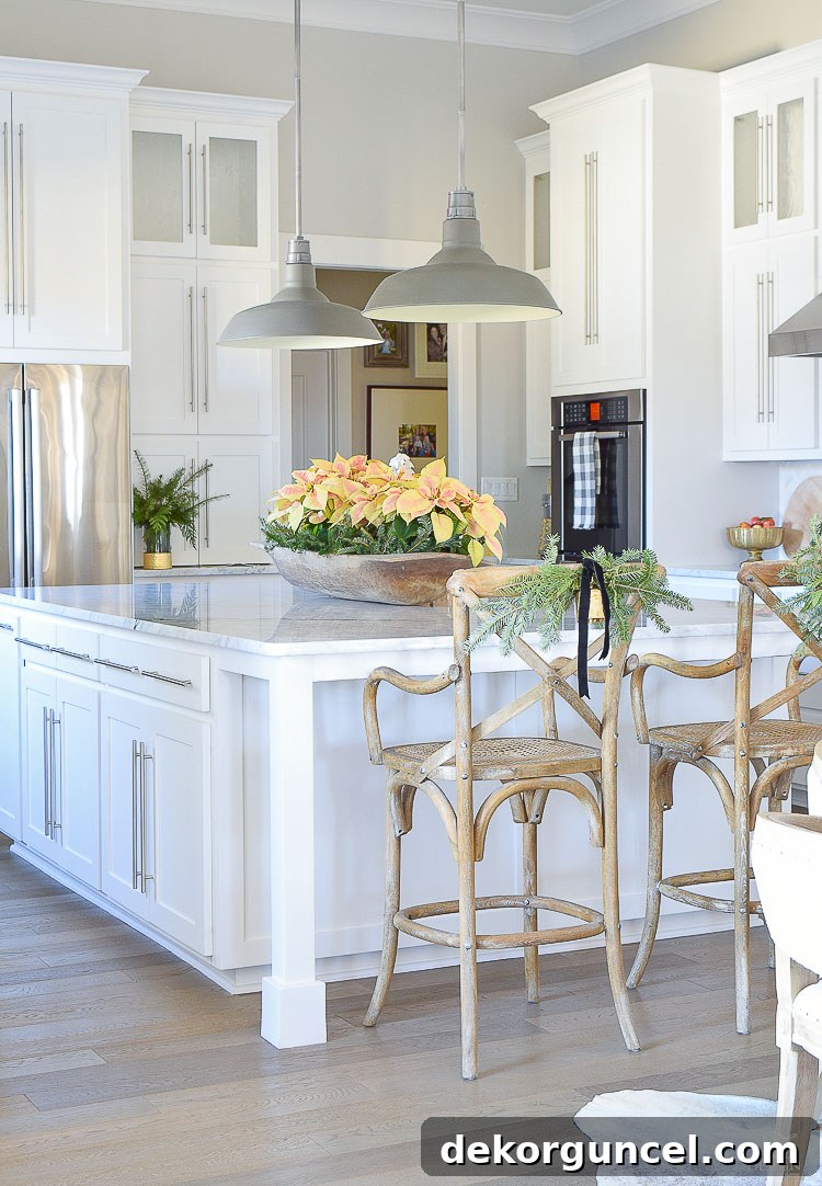 Kitchen cabinets painted in Benjamin Moore's Decorator's White - design by ZDesign at Home. This elegant white, with its subtle gray undertones, creates a bright and sophisticated culinary space.