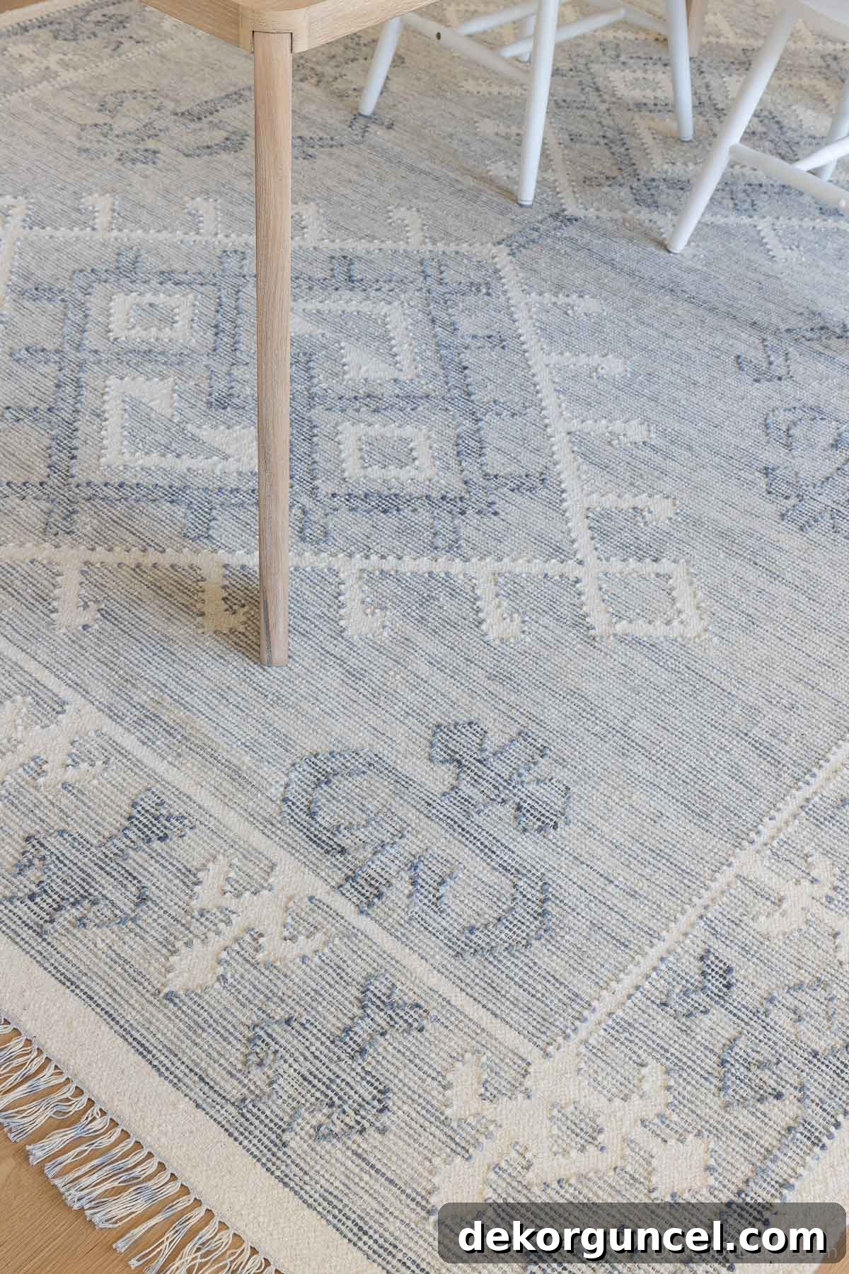Low pile patterned blue rug in our dining room