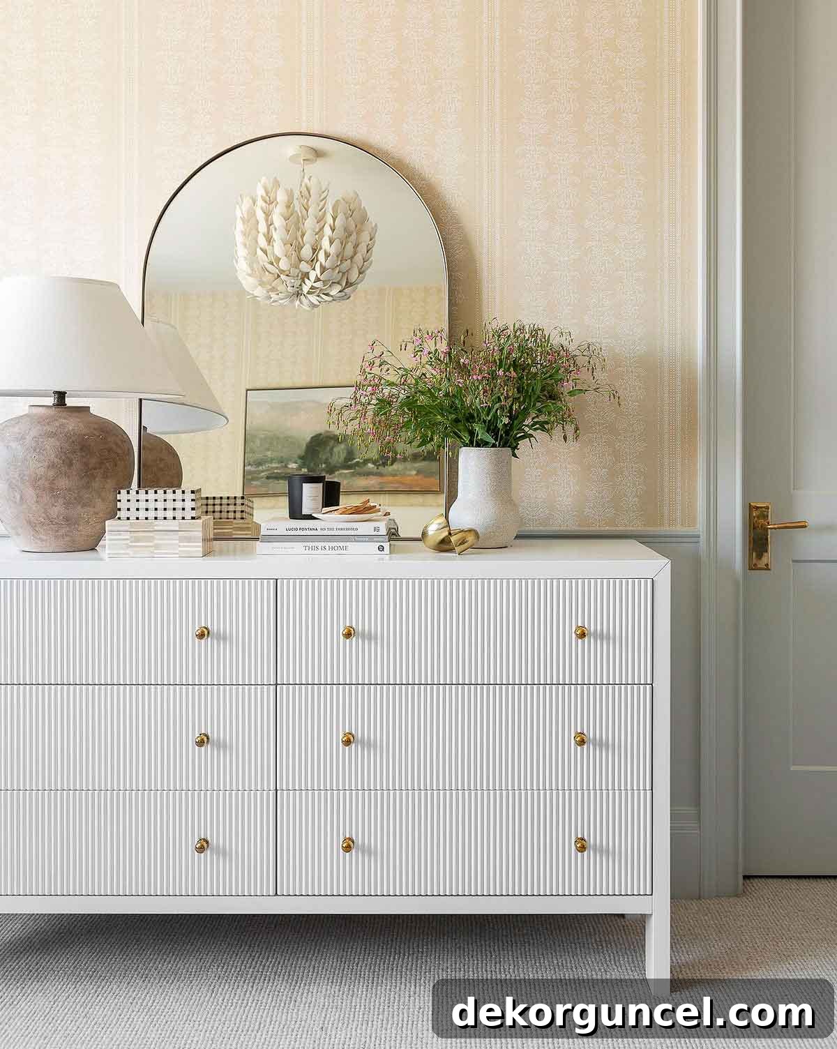 Fluted furniture pieces like this white dresser are a leading 2022 home design trend!
