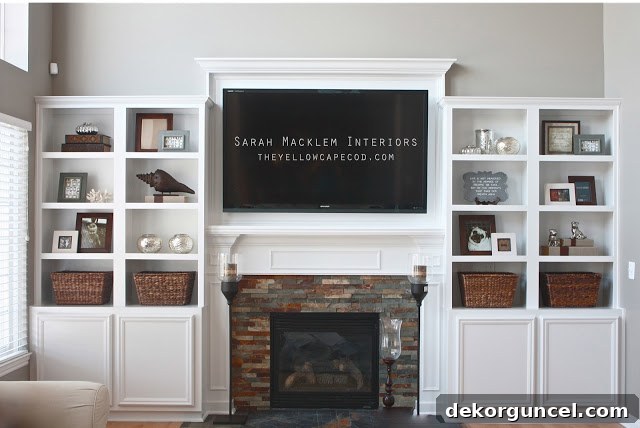 Loving the design of the TV mounted above the fireplace and bookcases on both sides for an ultimate media center.