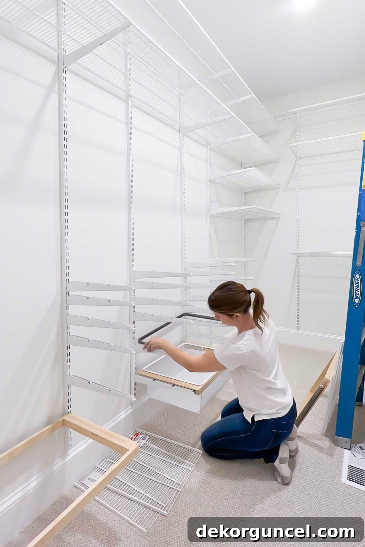 Installing the drawer slides onto the Elfa closet system brackets, preparing for the integration of pull-out drawers.