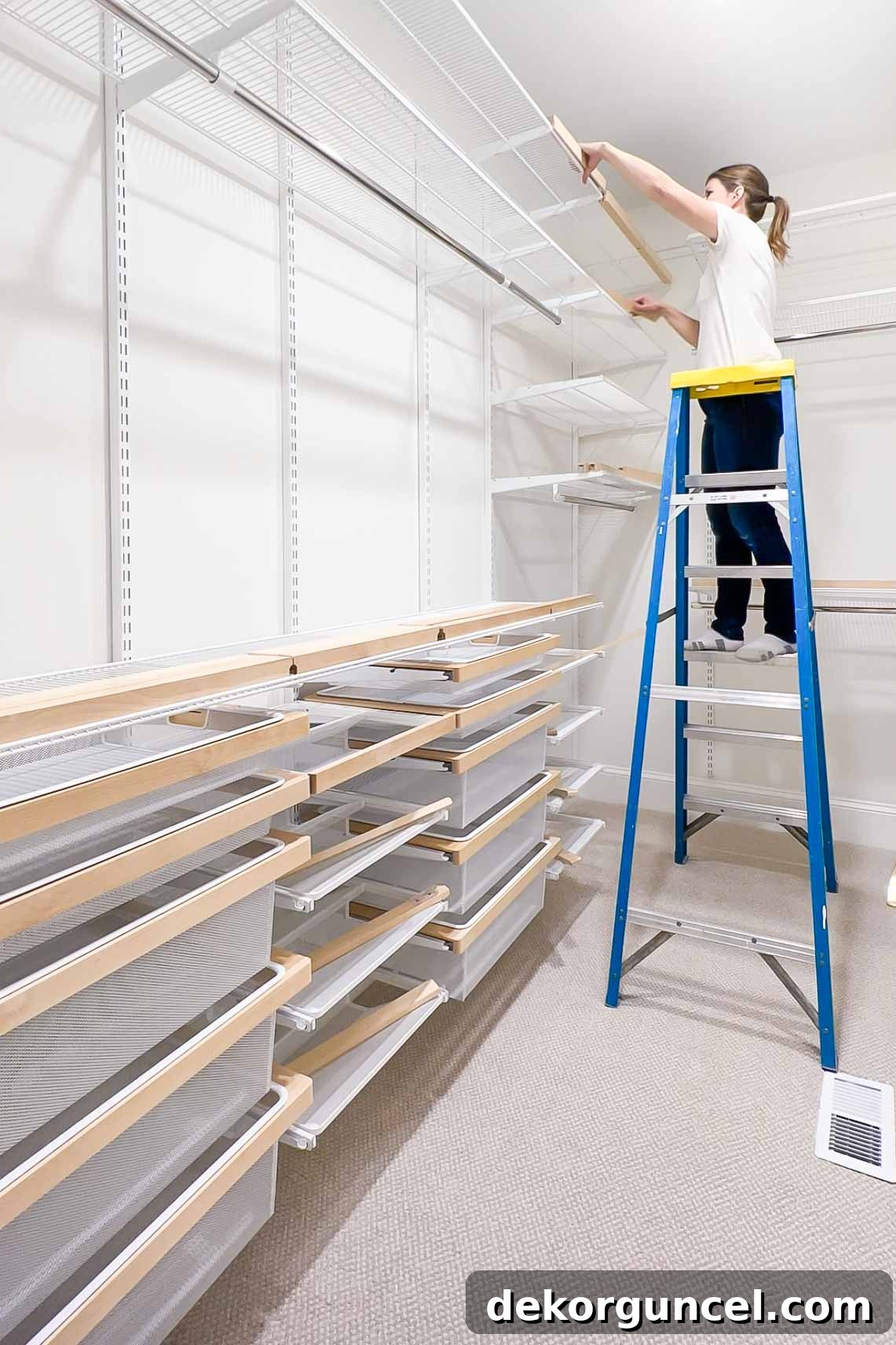 The elegant installation of Elfa Decor birch fascia onto the shelves, enhancing the aesthetic appeal of the closet system.