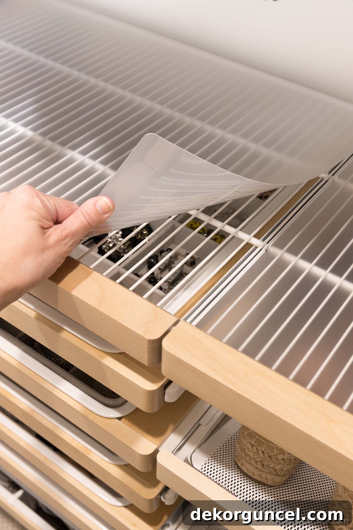 The protective and aesthetic shelf liners seamlessly integrated into our Elfa closet system, completing the look.