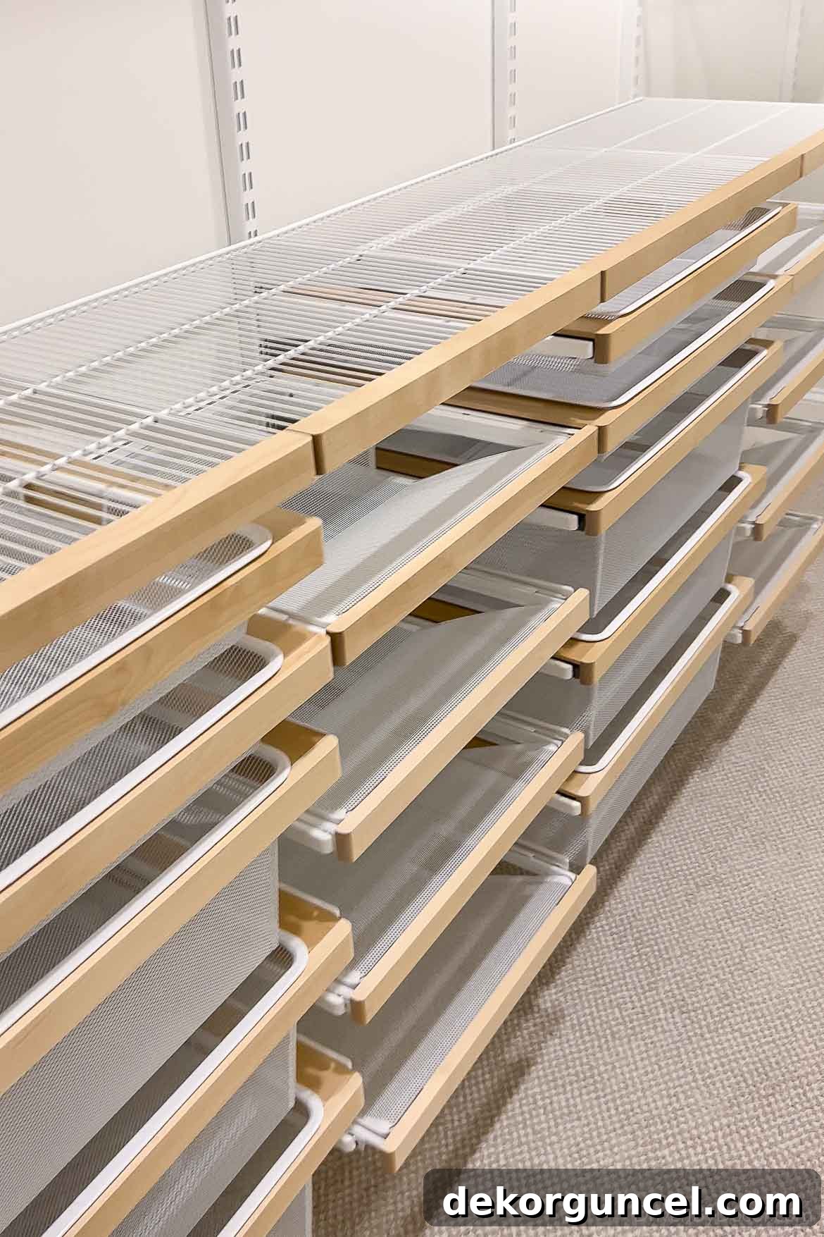 The neatly organized drawers within our new Elfa closet system, showcasing their functionality and sleek design.