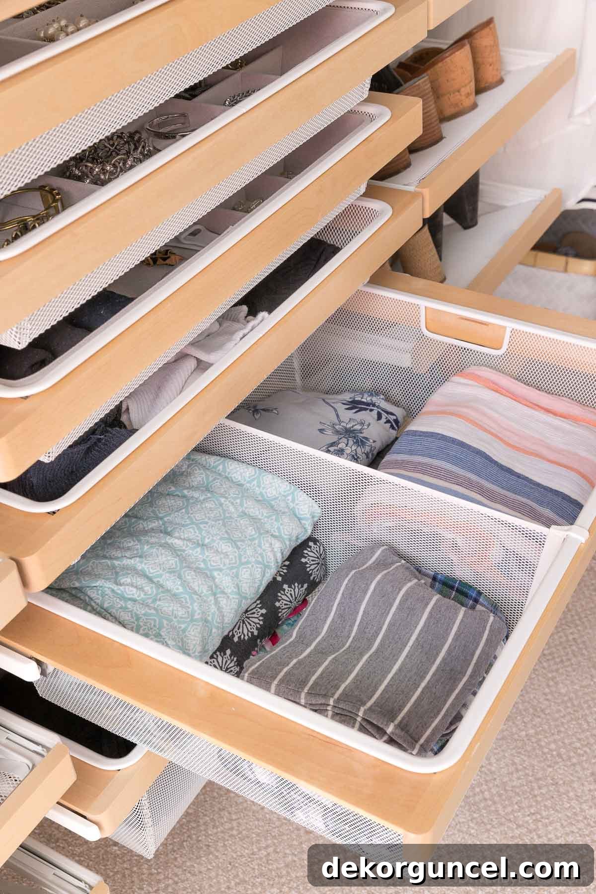 The wire mesh drawers characteristic of the Elfa closet system, showing their transparent design.