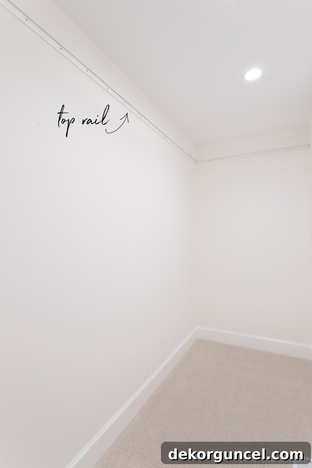 The essential first step: installing the top rail of our Elfa closet system, which serves as the foundation for the entire unit.
