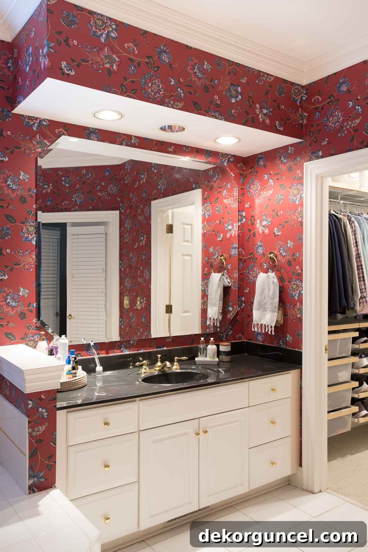 Poorly designed bathroom lighting featuring unflattering recessed lights directly over the vanity, creating harsh shadows.