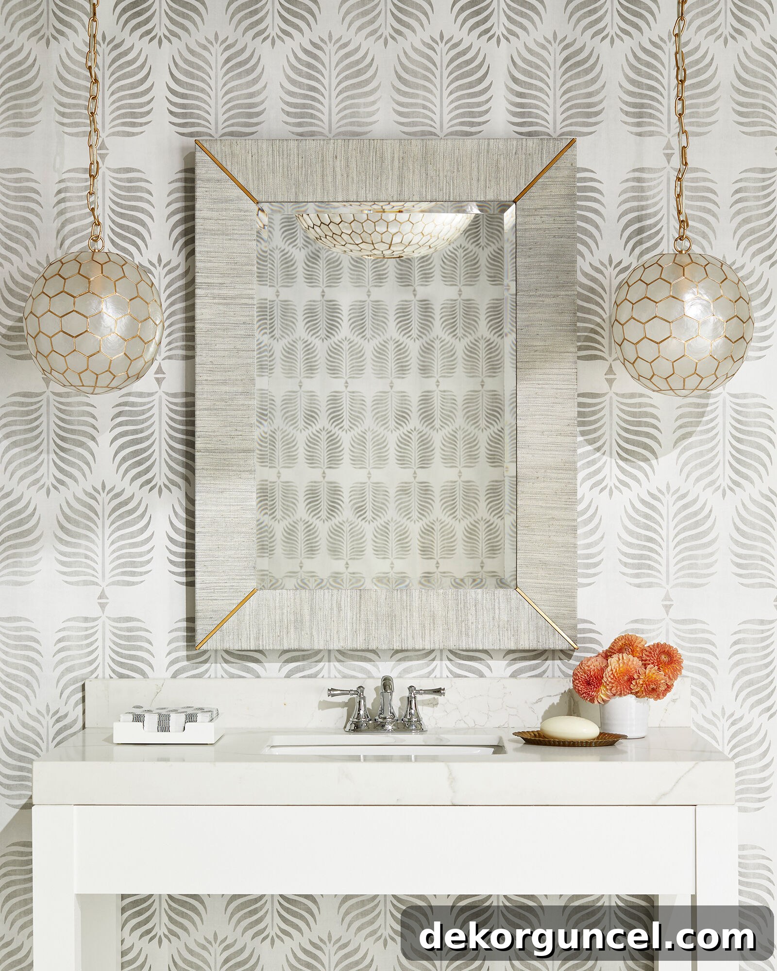 A chic bathroom vanity illuminated by elegant capiz pendants instead of traditional sconces, adding a unique and sophisticated touch.