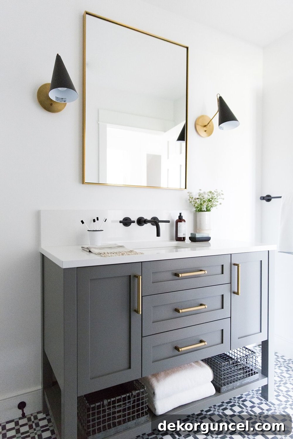A modern guest bathroom featuring unique, sleek sconces that beautifully flank a mirror above the vanity, demonstrating innovative lighting choices.