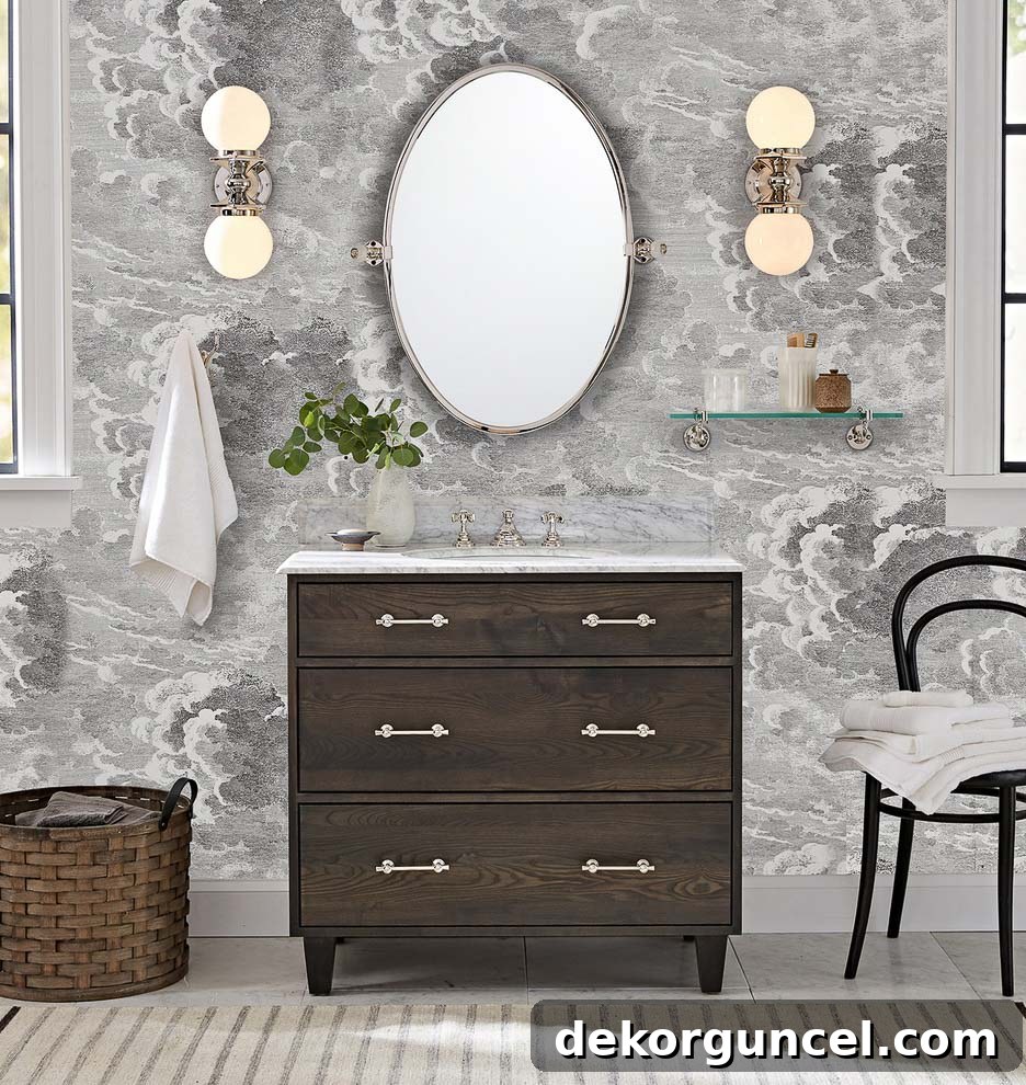 Two elegant double globe sconces mounted vertically, flanking a bathroom mirror, providing a balanced and sophisticated lighting solution.