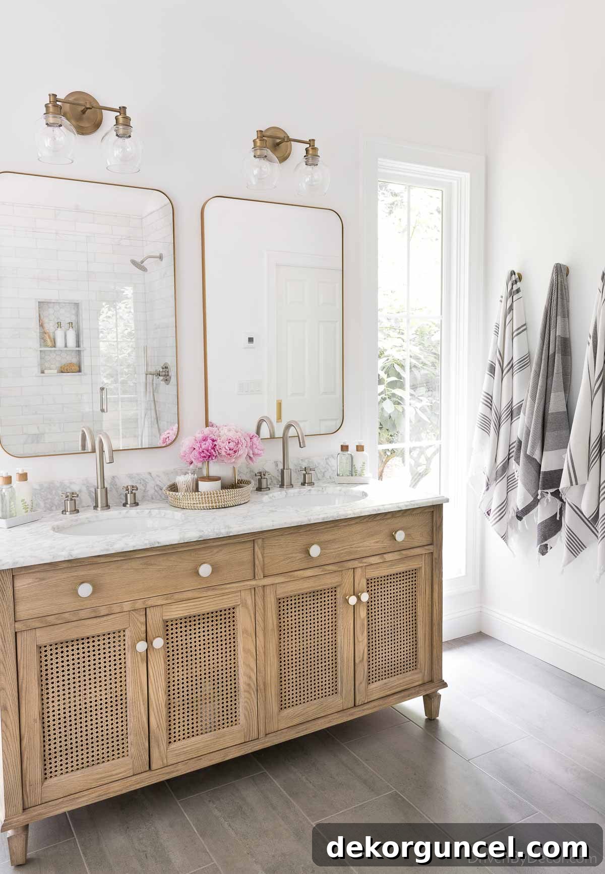 A stylish bathroom design showcasing expertly mixed metal finishes, combining brushed nickel faucets with aged brass vanity lights for a sophisticated look.