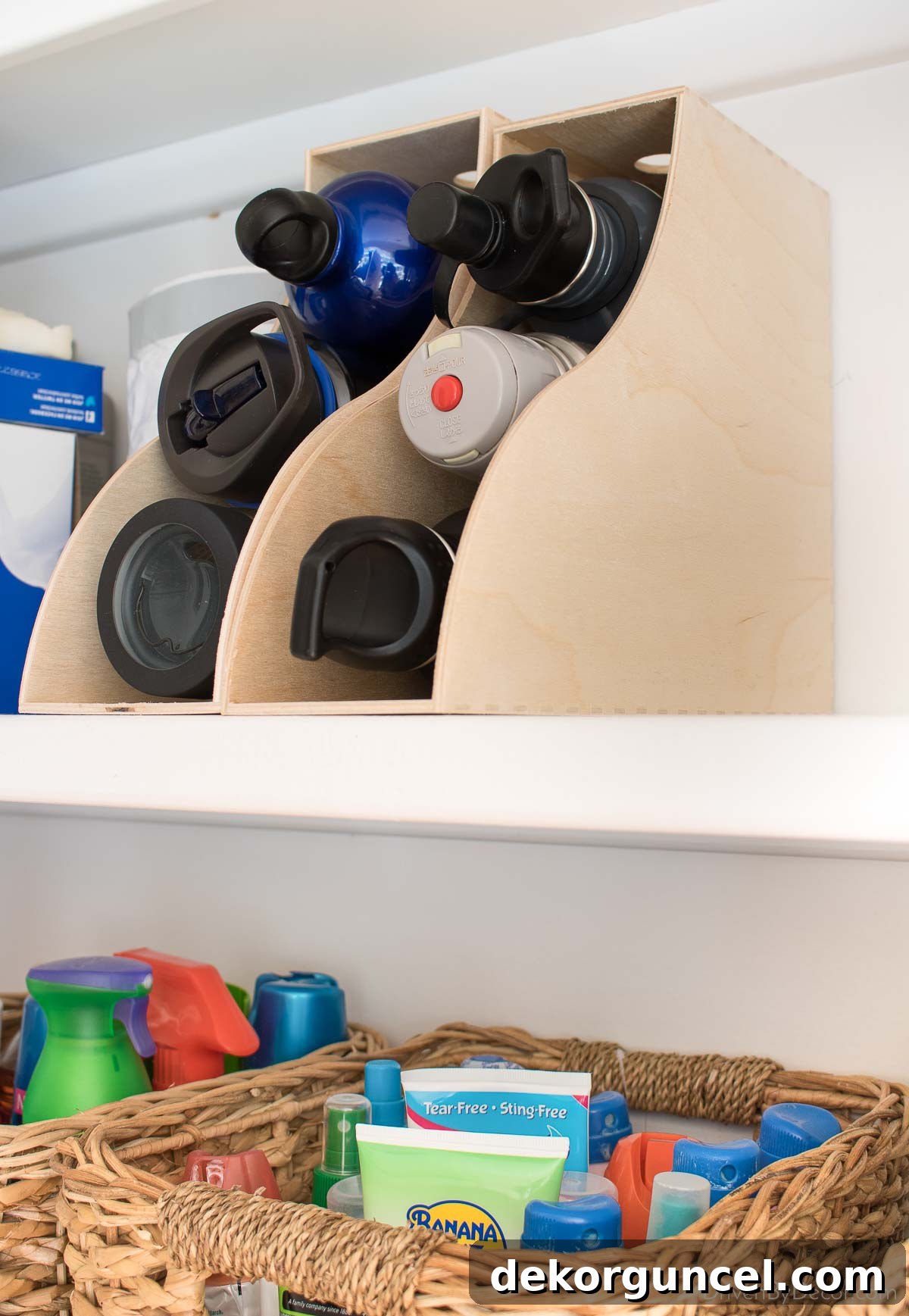 Brilliant Kitchen Cabinet Organization Hacks 14 Magazine racks flipped on their back make great water bottle holders for kitchen cabinet organization