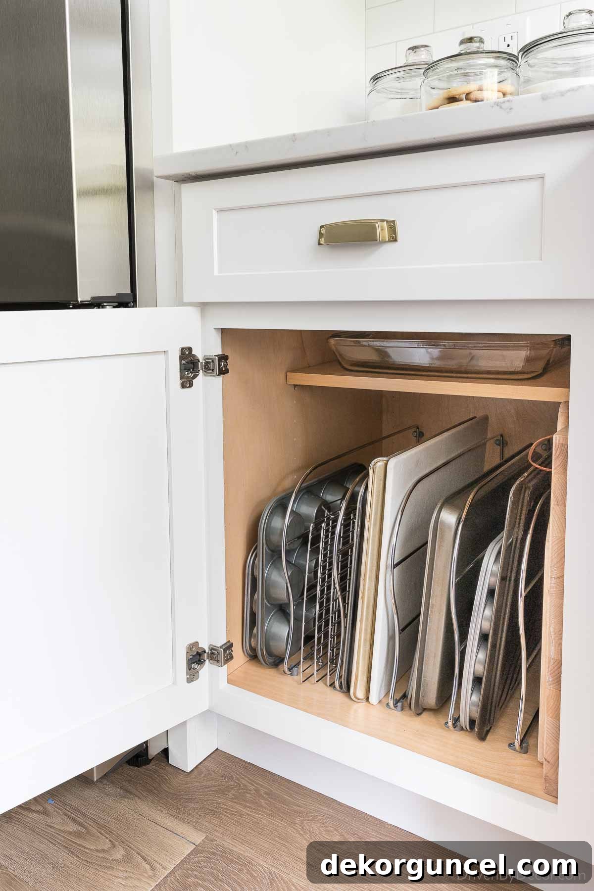 Brilliant Kitchen Cabinet Organization Hacks 5 Cabinet dividers for organizing trays and sheets in your kitchen