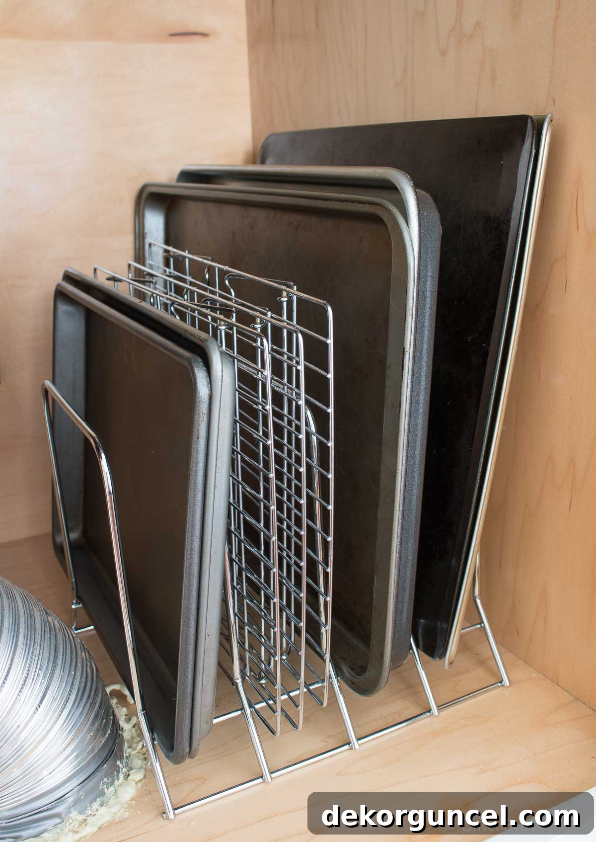 Brilliant Kitchen Cabinet Organization Hacks 6 Organized baking sheets & pans on a divided metal rack in a kitchen cabinet