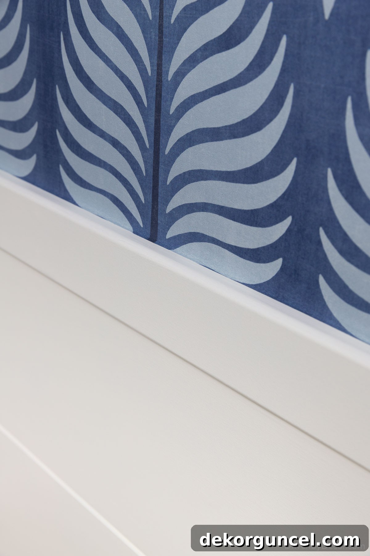 A close-up of the elegant and shallow trim piece capping the top of our bathroom shiplap, featuring its distinctive rounded edges
