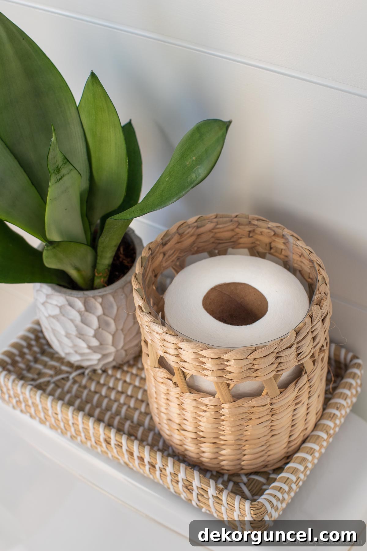 This stylish woven canister is perfectly sized to store an extra roll of toilet paper discreetly and conveniently
