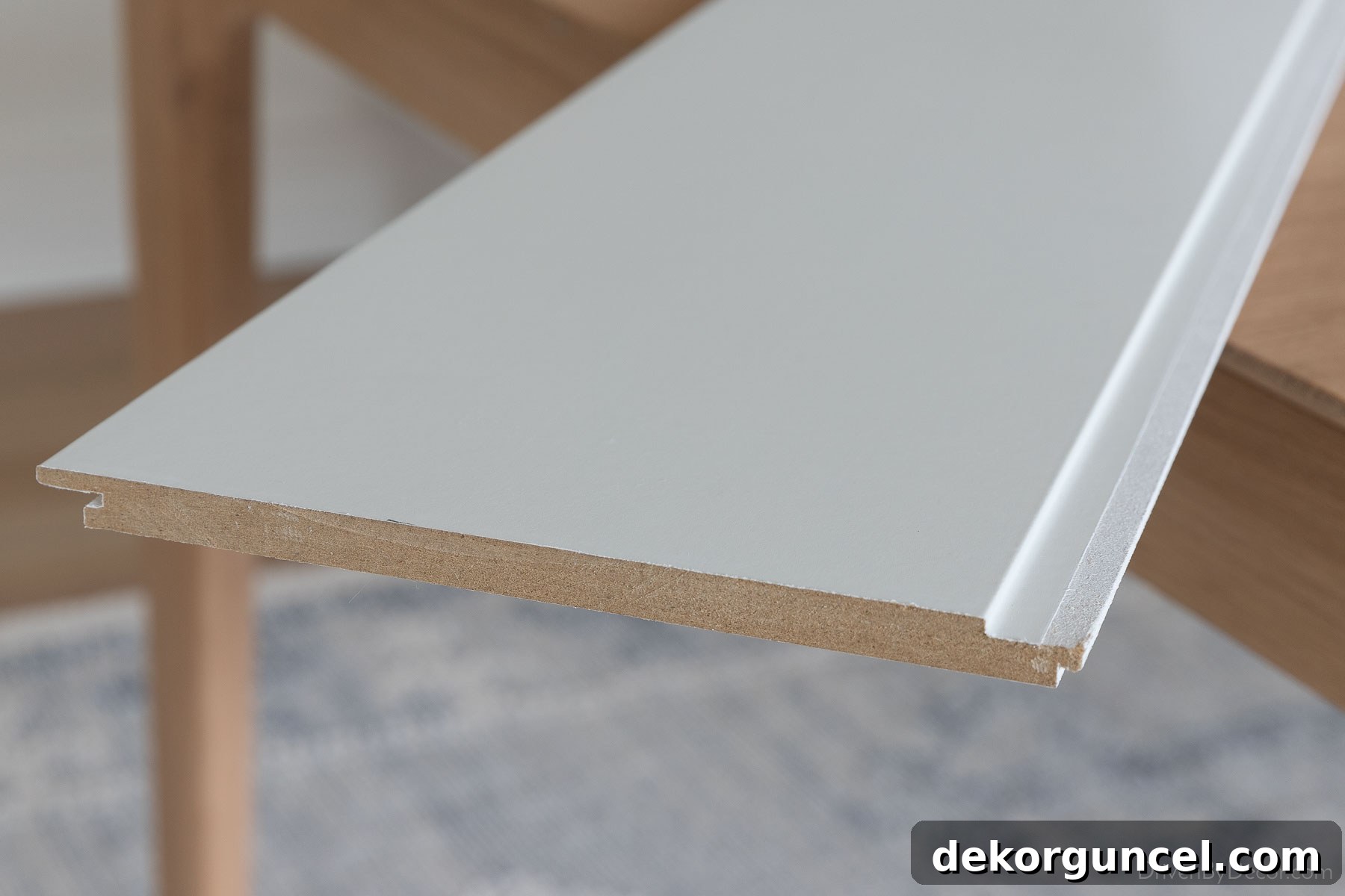 Close-up of the smooth MDF shiplap we selected for our hall bathroom, highlighting its wide 7-inch boards and clean finish