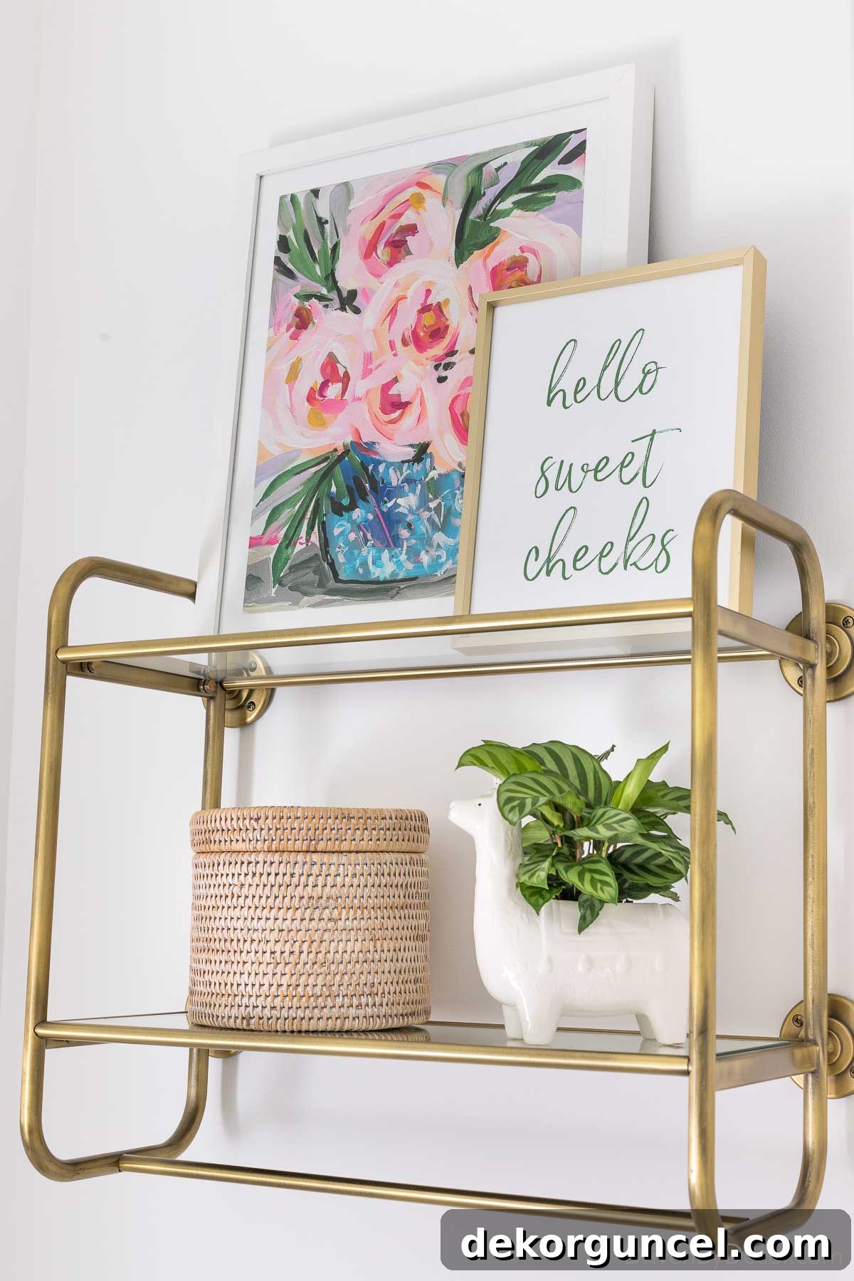 Unlock Vertical Space: Over-The-Toilet Organization 5 Brass and glass open shelving over the toilet