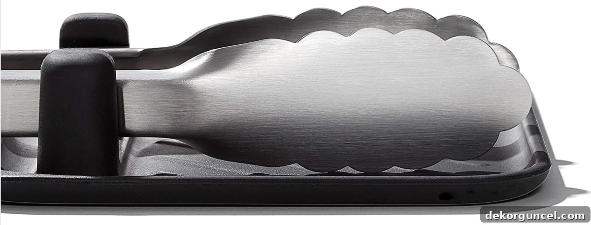 Heat-resistant silicone grilling tool rest, perfect for holding tongs and other BBQ utensils, makes a great Father's Day gift.