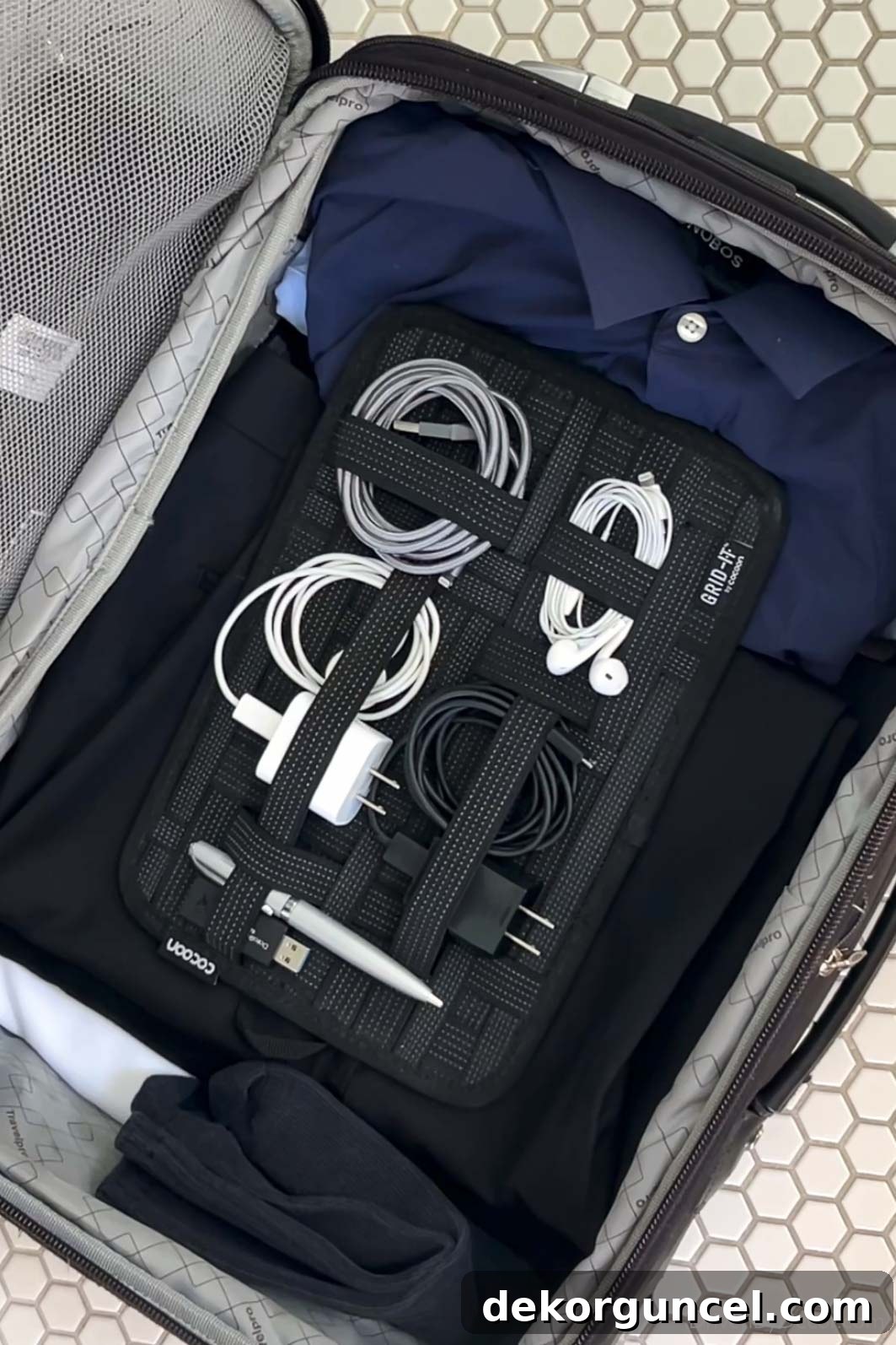 Grid-It travel organizer with elastic straps to keep cords and other small items neat and tangle-free during travel.