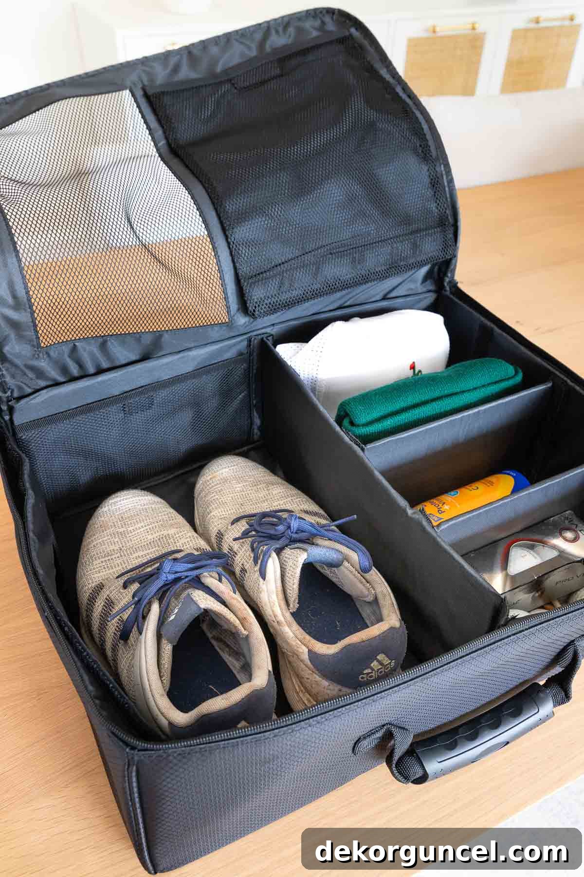 Golf trunk organizer with golf shoes, hats, balls, and tees neatly stored inside, perfect for keeping gear tidy.