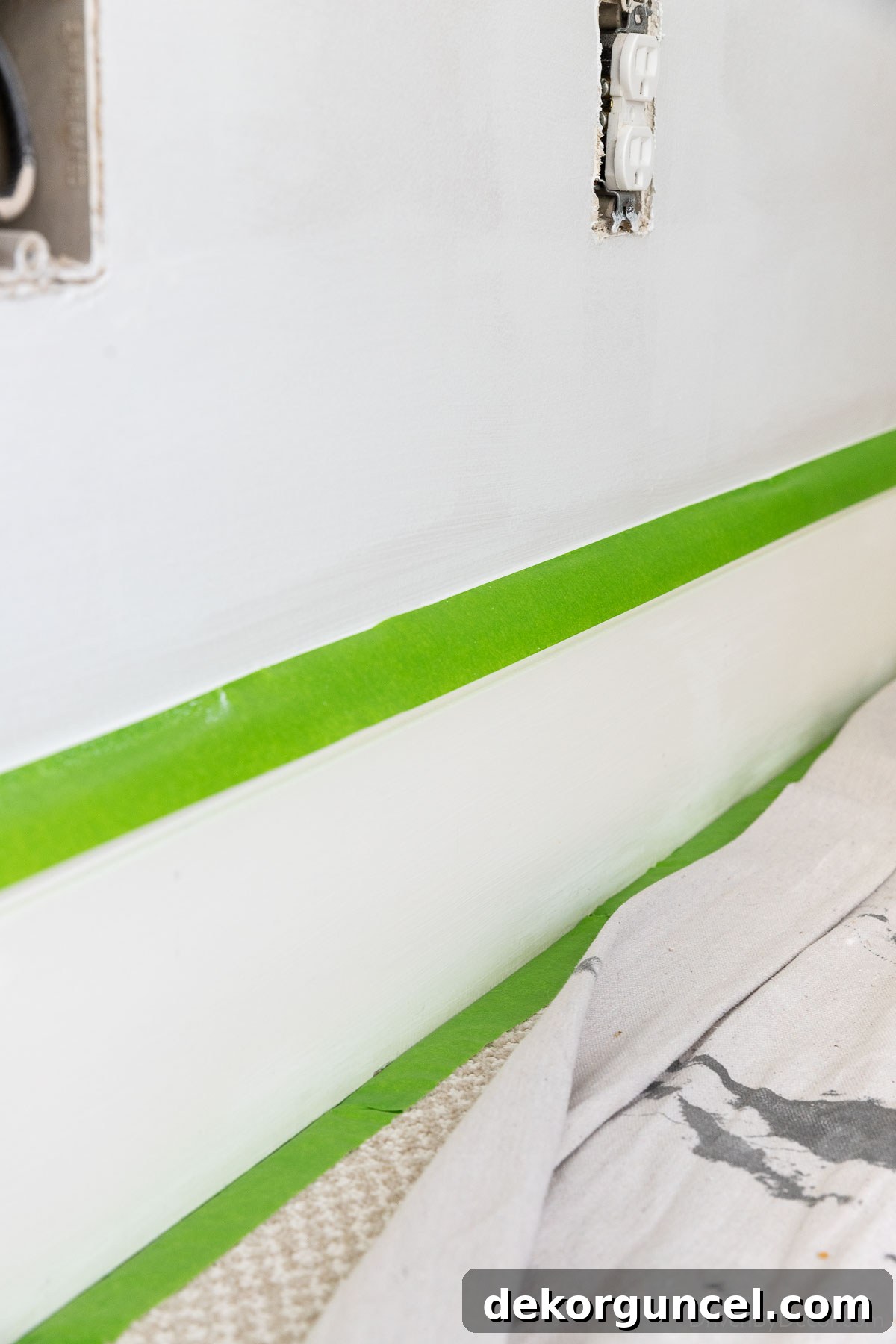 Master Room Painting: 10 Easy Steps for a Perfect Finish 18 Apply painter's tape to top of baseboards to shield from paint splatter