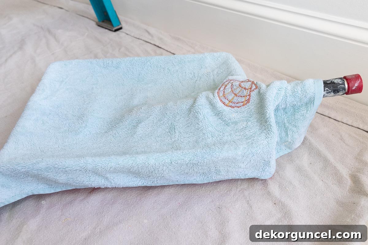 Master Room Painting: 10 Easy Steps for a Perfect Finish 25 Damp towel over paint tray to keep it from drying out