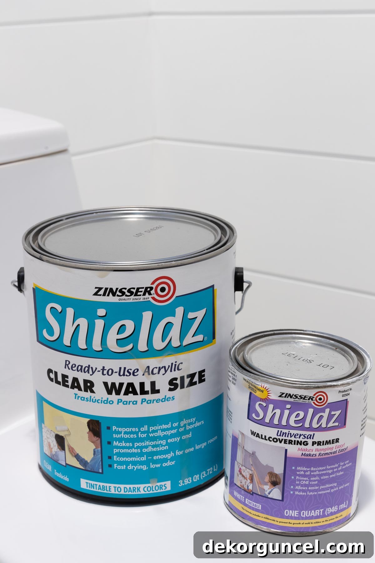 Two types of wall sizers by Shieldz, one clear and one white, essential for preparing walls before wallpaper installation.