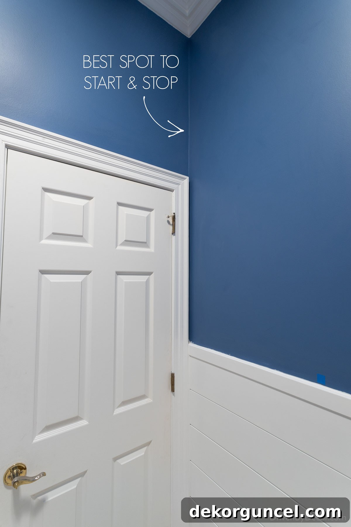 An interior corner above a doorway, marked as the starting and stopping point for wallpaper installation.