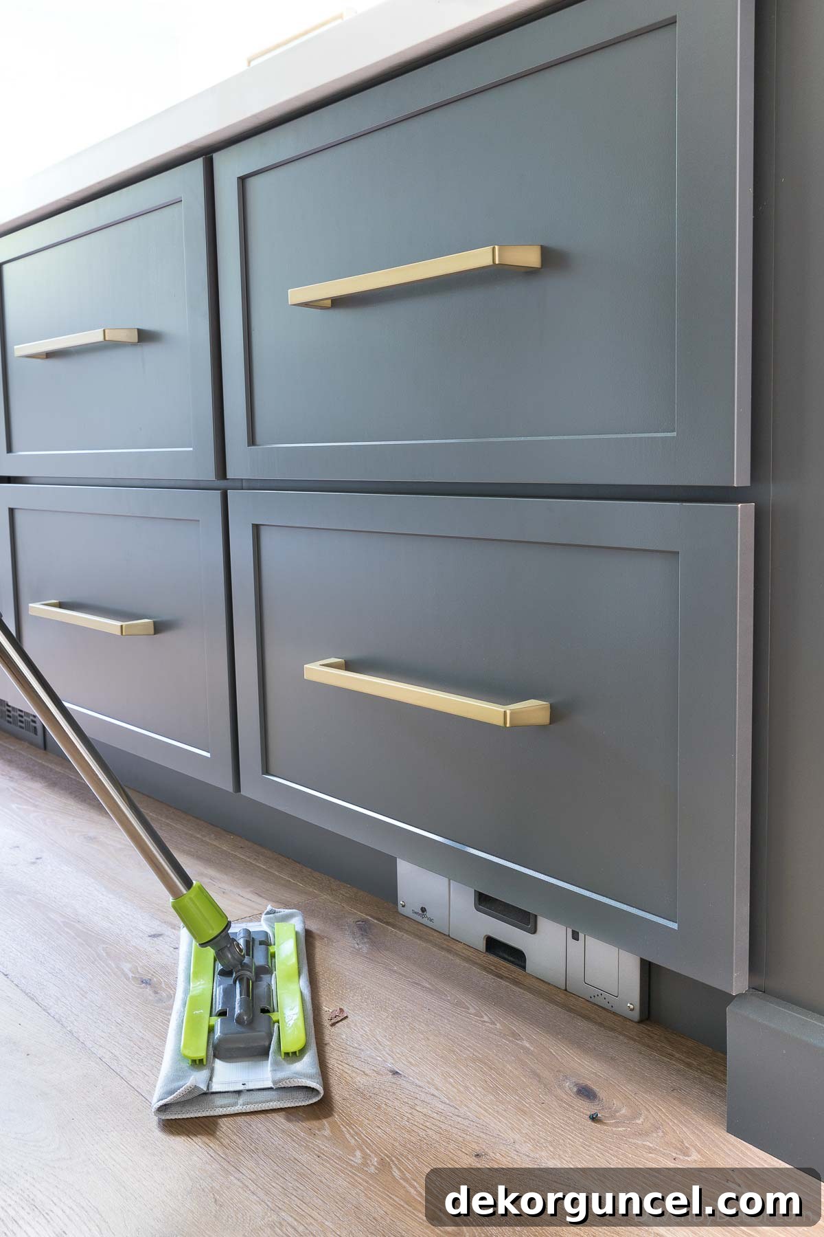 Vacuum built into kitchen island toekick