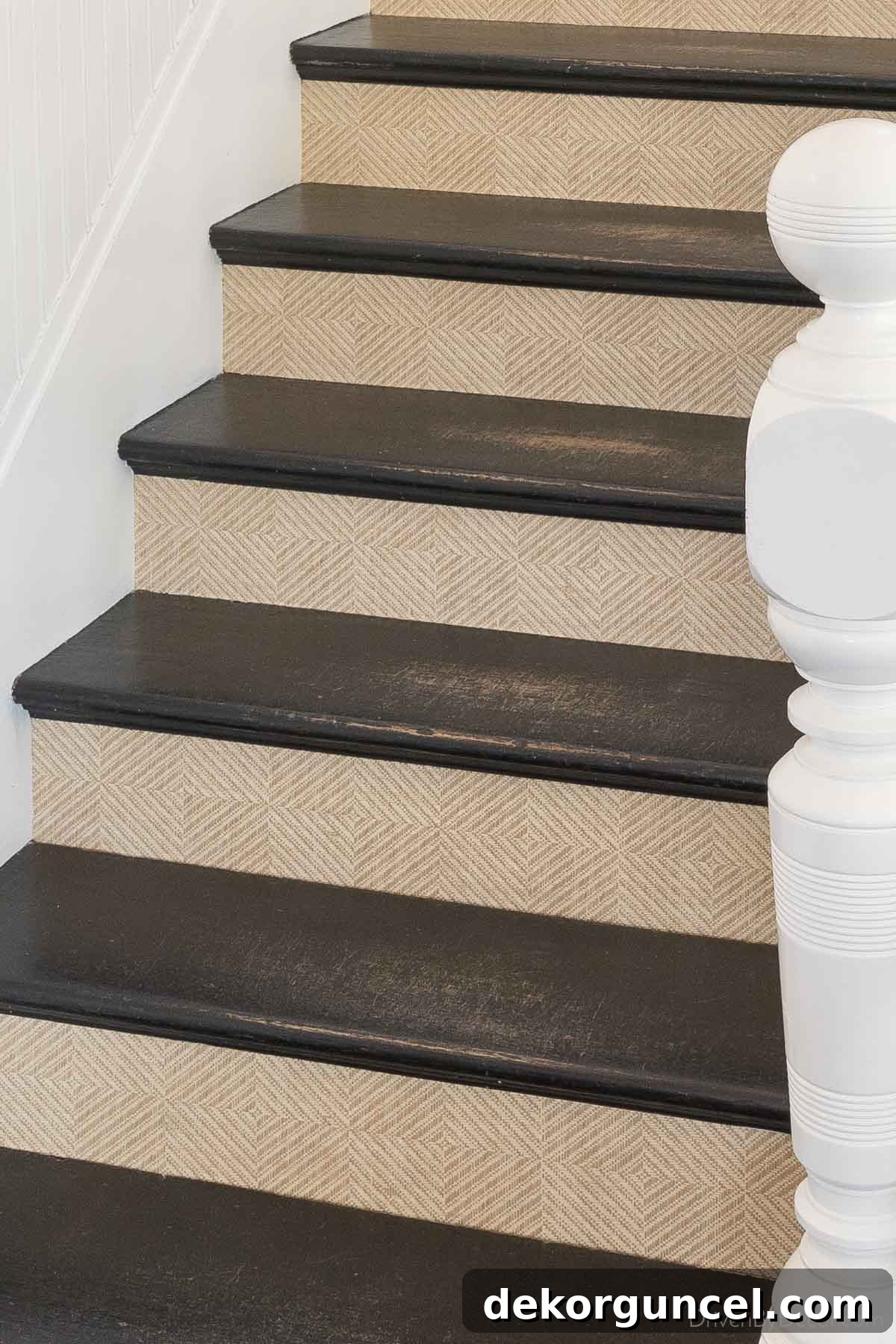 Patterned grasscloth wallpaper on the risers creates a beautiful staircase!