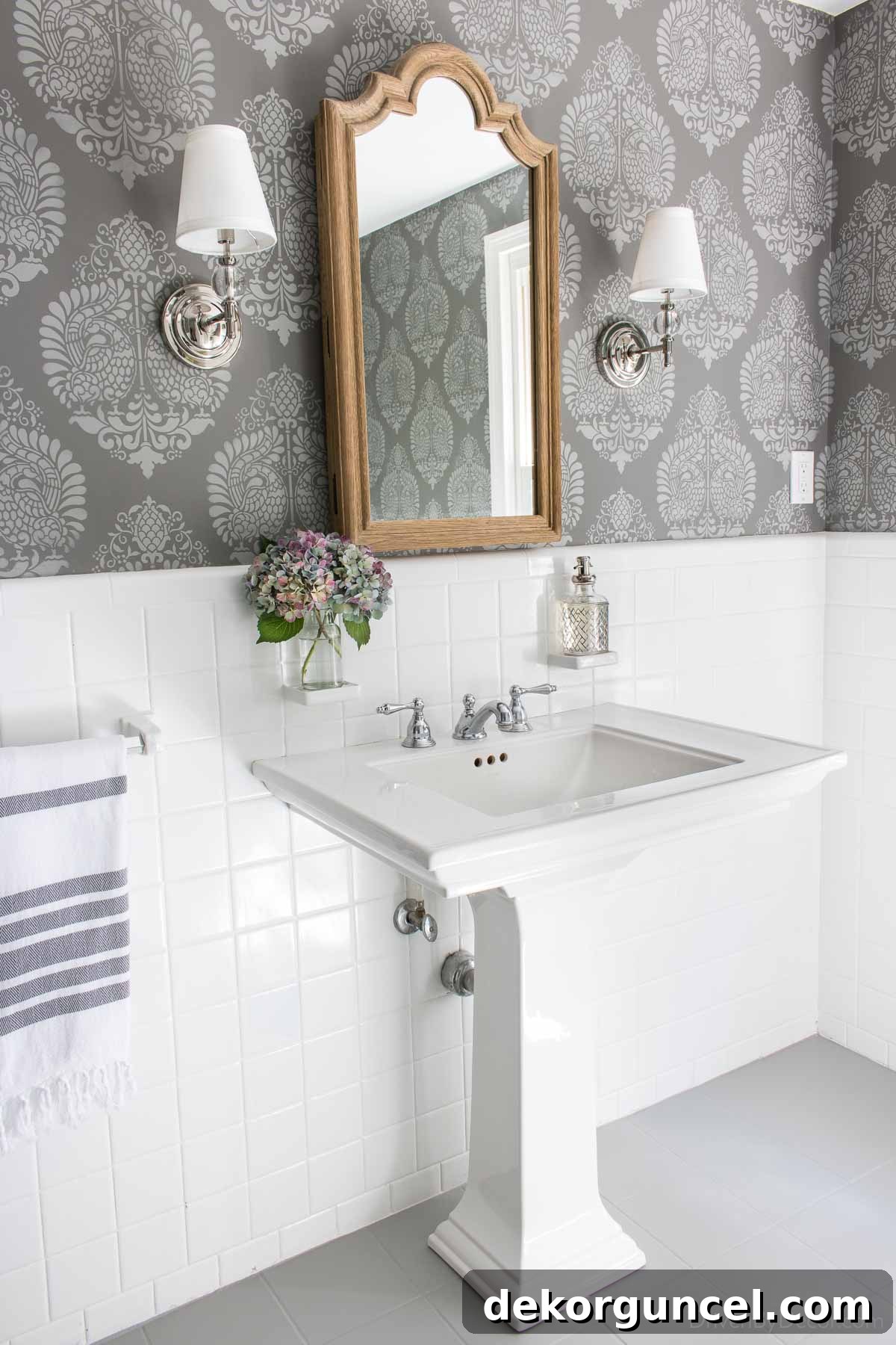 The mirror over the sink is actually a recessed medicine cabinet - perfect for extra bathroom storage!
