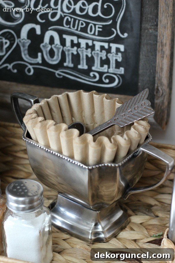 Trophy cup holds coffee filters and spoon as part of home coffee bar!