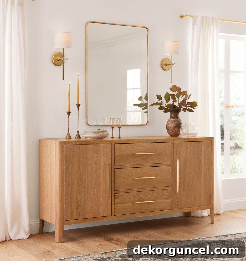 Wall sconces flanking a mirror as console table decor