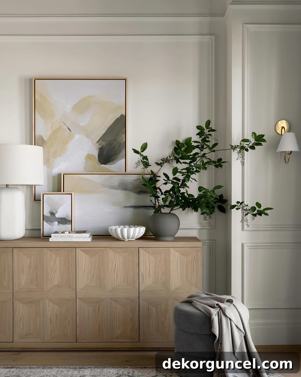 Layered art on sideboard for a sophisticated look