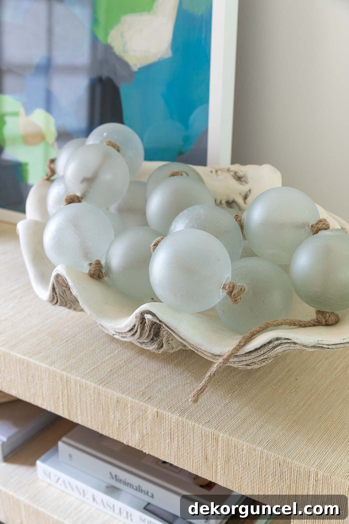 Decorative clam shell filled with glass bead garland, a stylish year-round accent