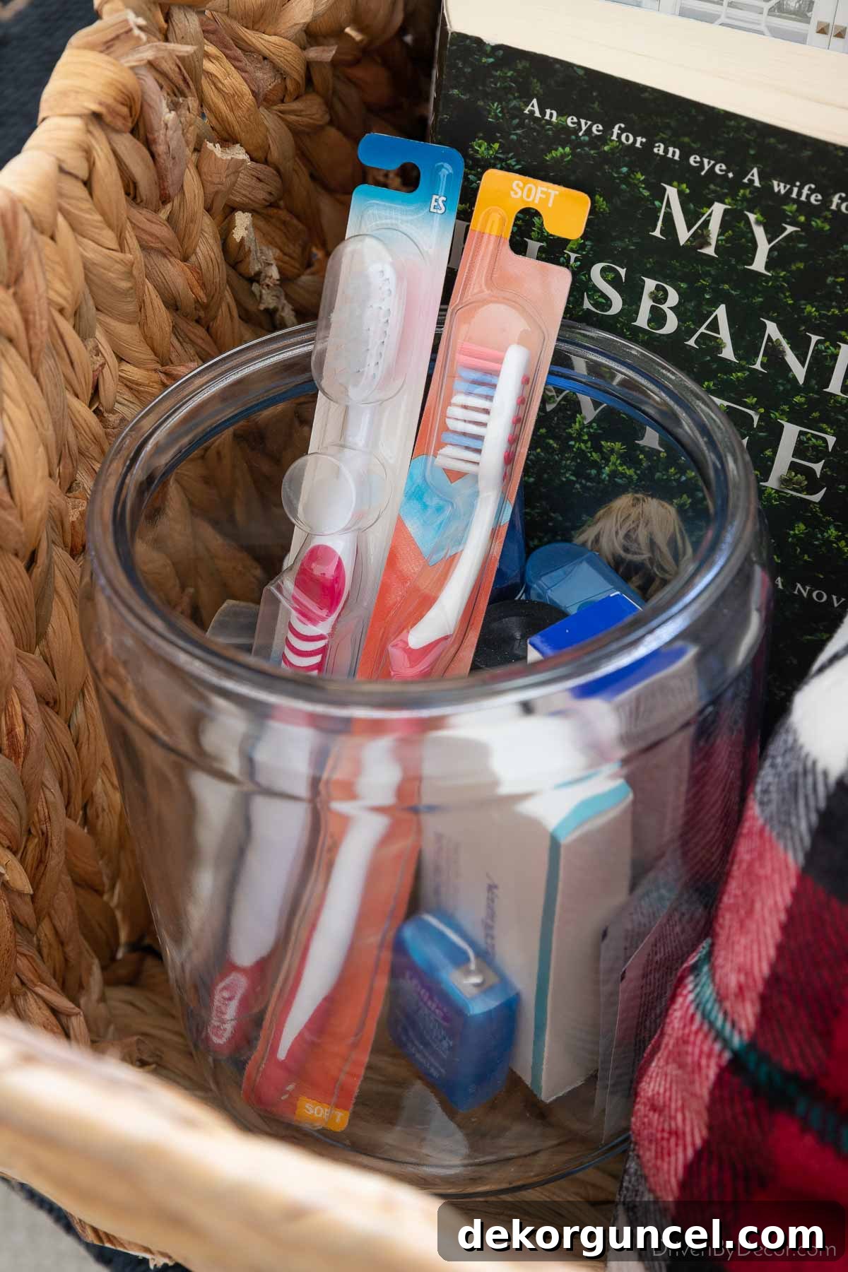 Glass jar filled with an assortment of extra toiletries for guest convenience