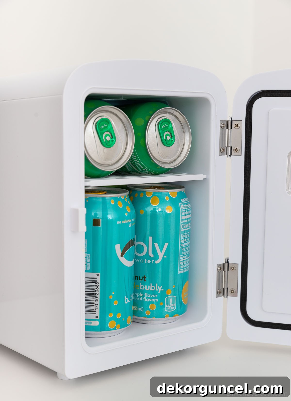 Interior view of the mini fridge, showing its capacity for 6 cans