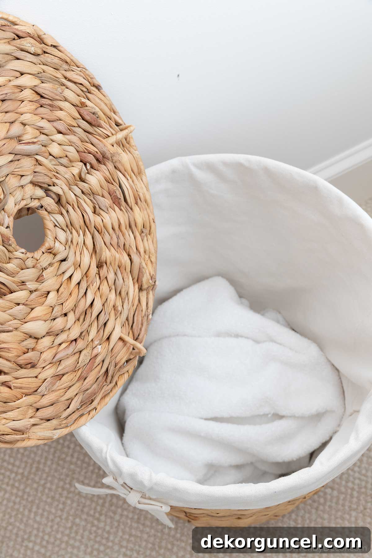 Close-up of the soft fabric lining inside a woven basket, designed to protect clothes
