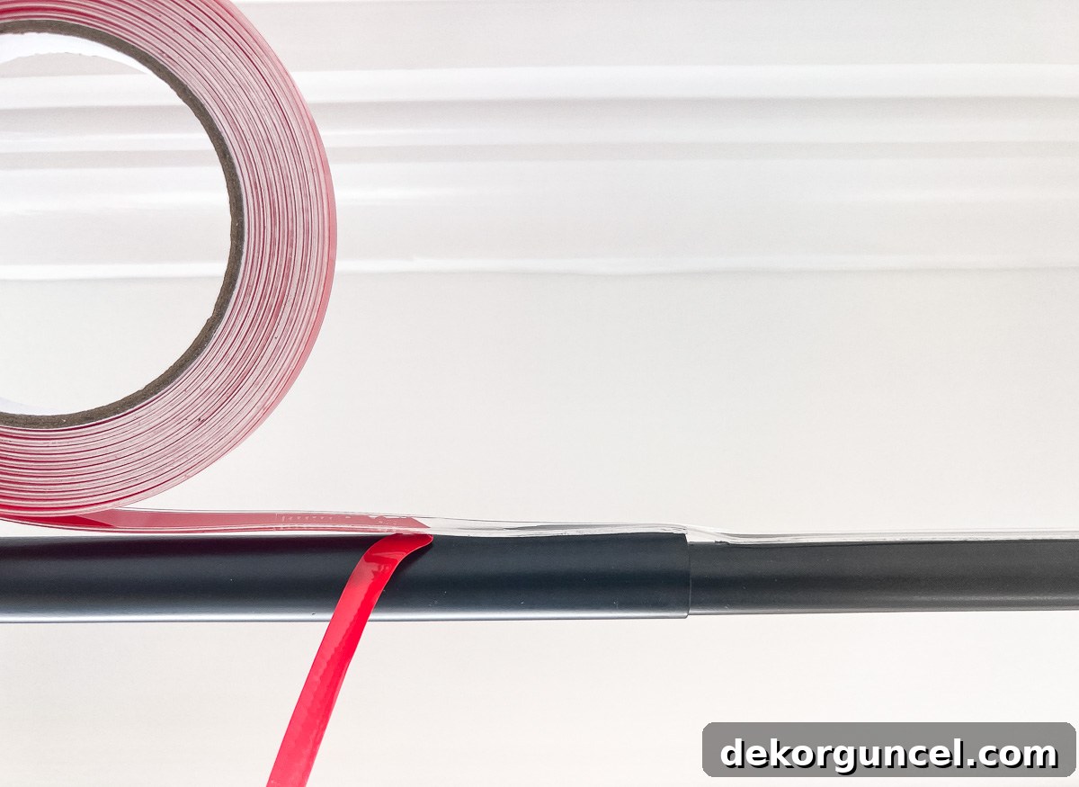 Tape applied over joint of telescoping curtain rod