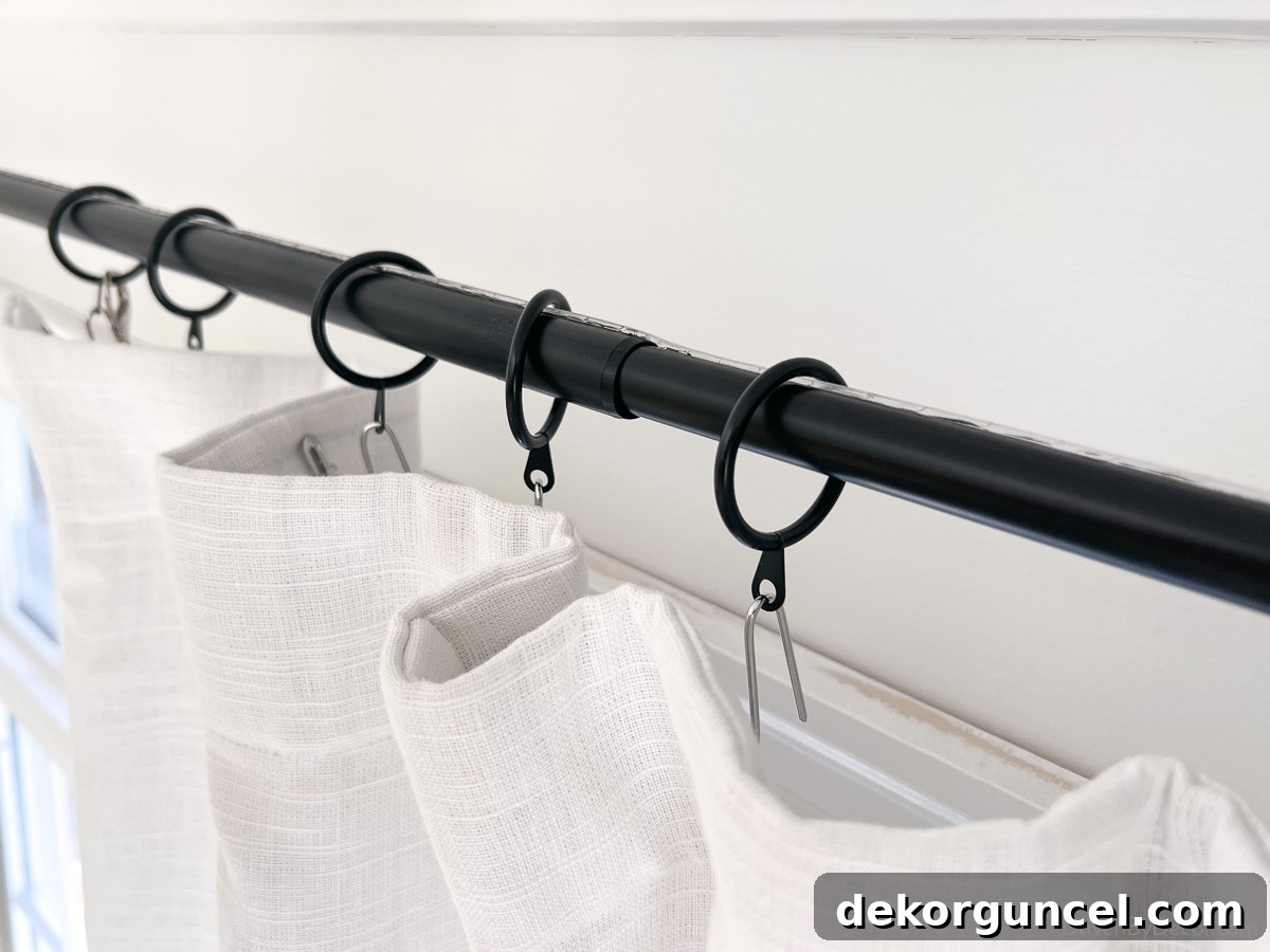 Curtain rod tape applied to top of curtain rod