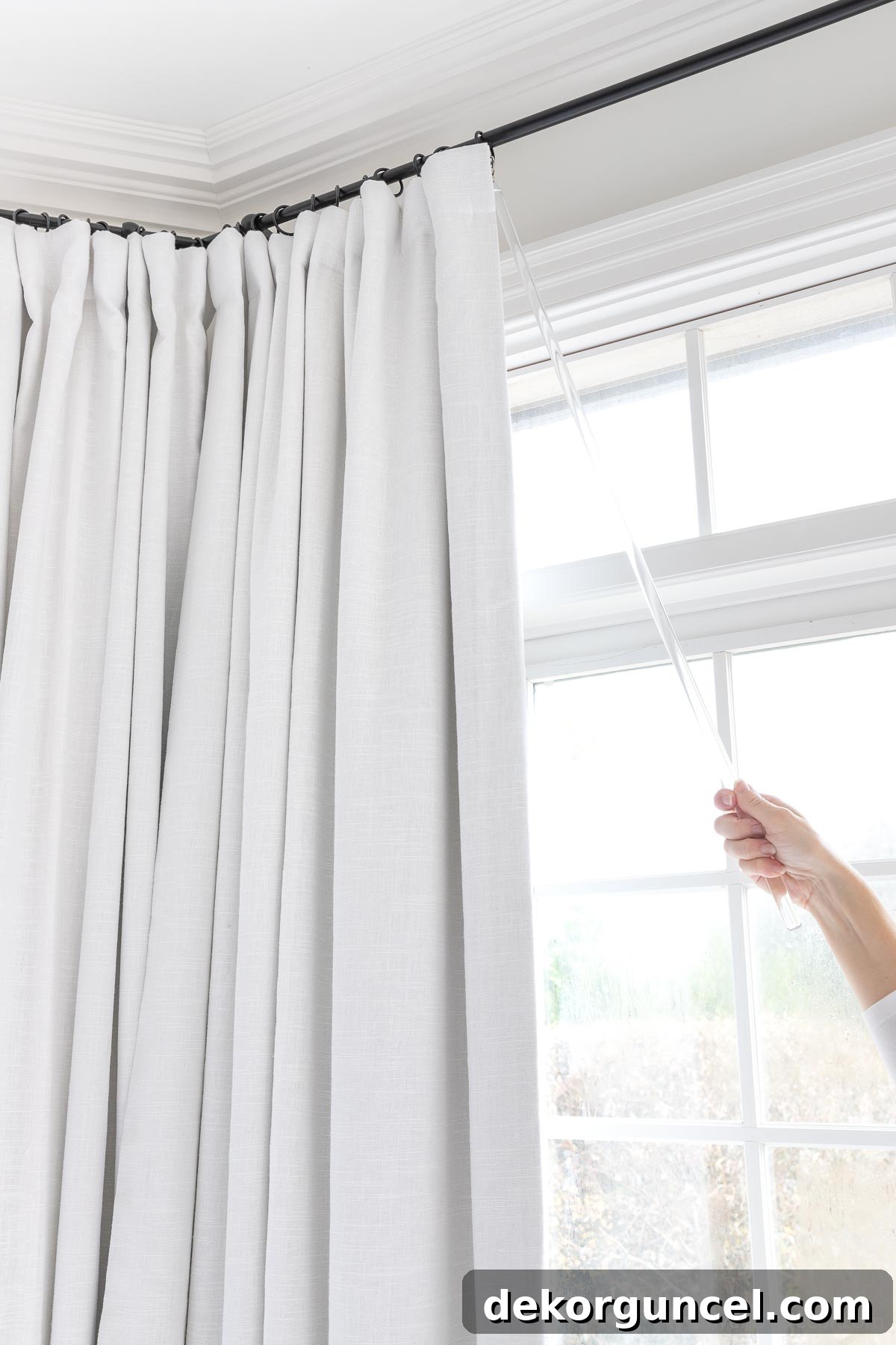 Closing drapes with an acrylic curtain wand