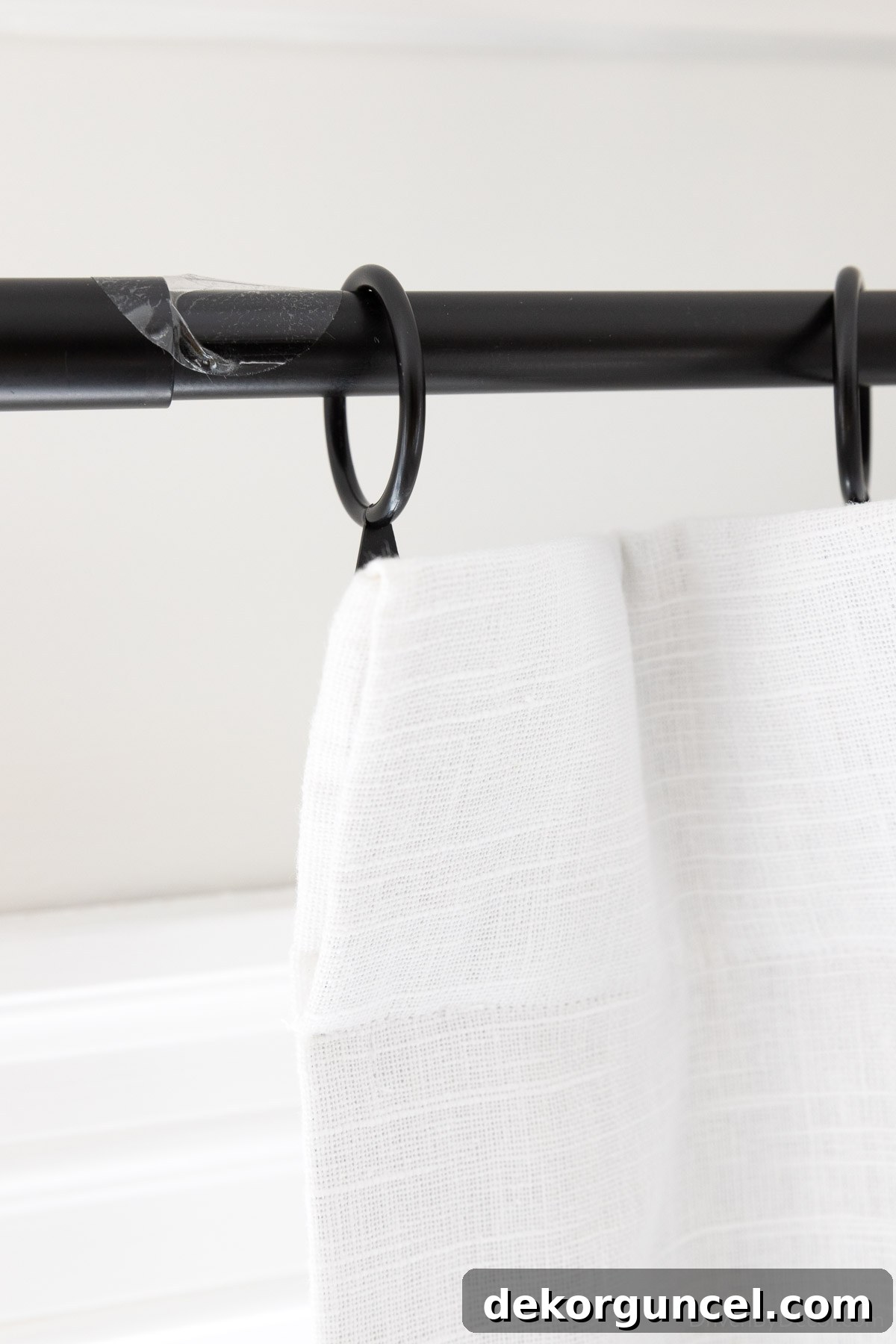 Curtain rod joint ramp sticker applied to rod