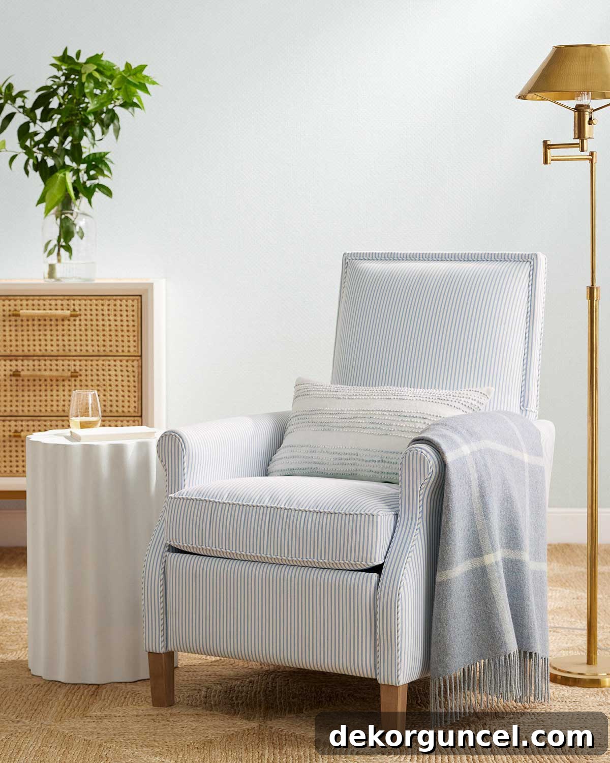 Custom upholstered recliner with sophisticated striped blue fabric and elegant welting detail