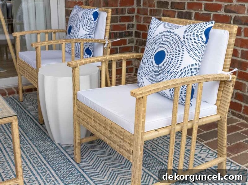 7 Frugal Back Porch Design Secrets 13 Pair of woven chairs adorned with patterned outdoor pillows, part of an affordable conversation set